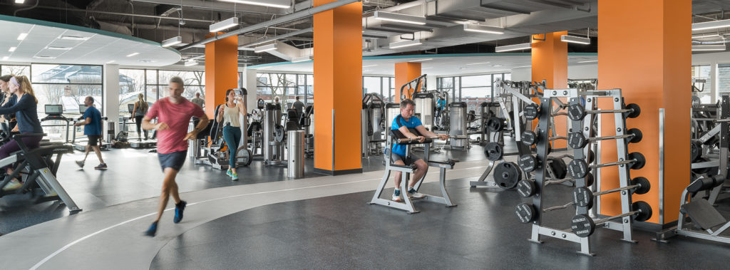 Activity in the GBYMCA wellness area with bright orange pillars