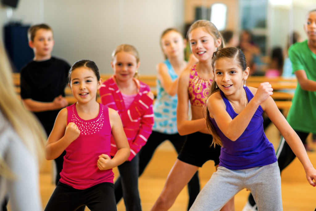 School age kids dancing in active class